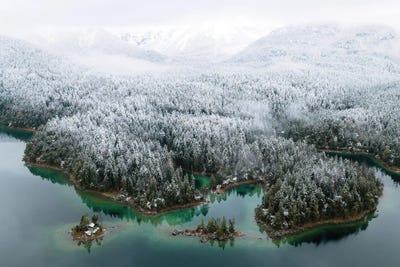 Mountain Lake From Above With Forest Covered In Snow by Michael Schauer framed wall art
