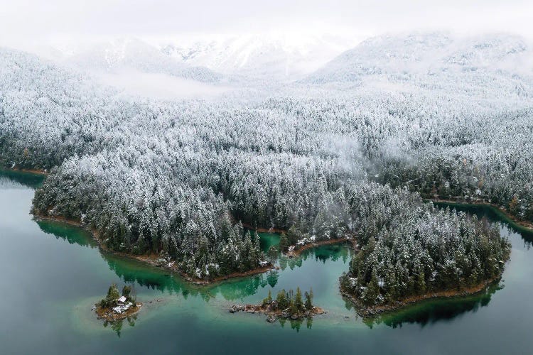 Mountain Lake From Above With Forest Covered In Snow