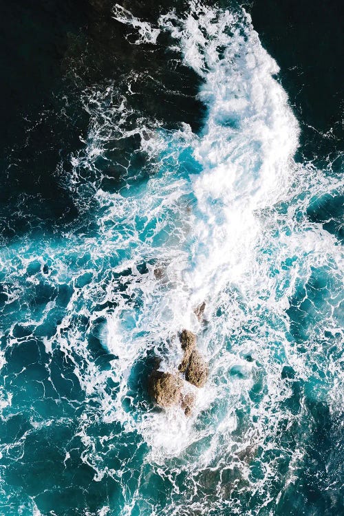 Waves Clashing Against A Rock In The Ocean