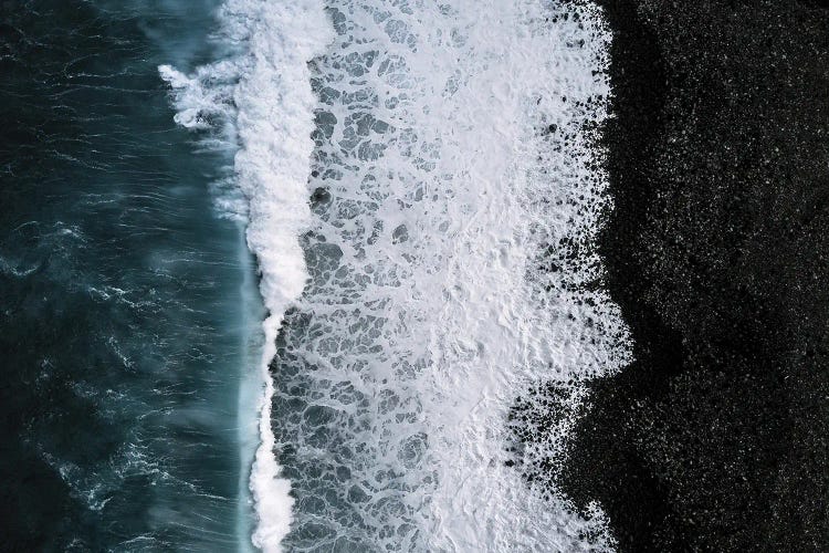 Black Sand Beach Being Hit By A Wave From Above