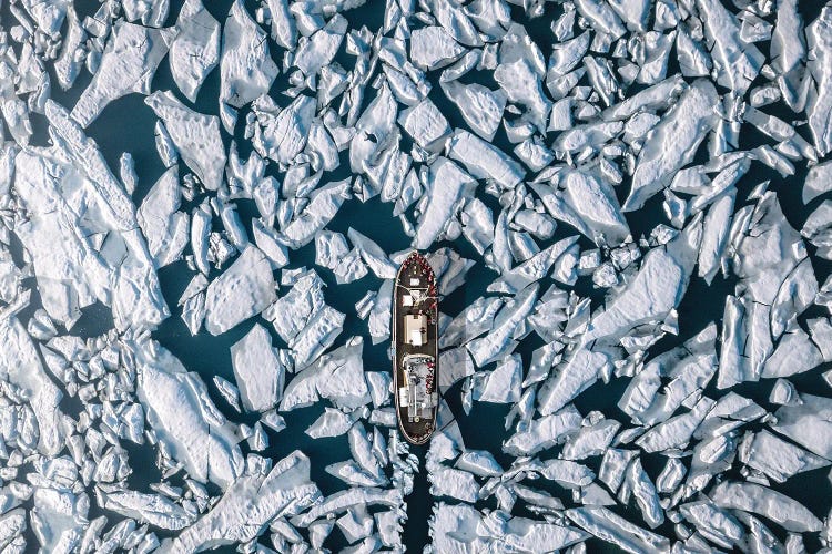 Icebreaker Pushing Its Way Through The Frozen Ocean From Above