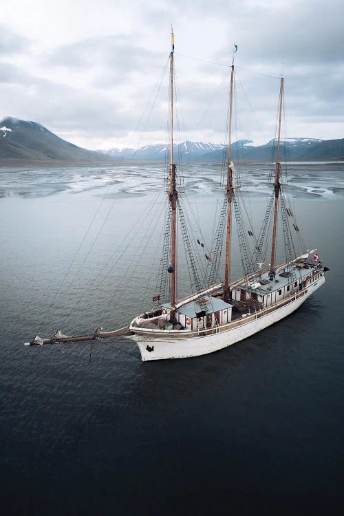 Sailing Ship Anchored In Svalbard In Front Of A Glacial River Delta