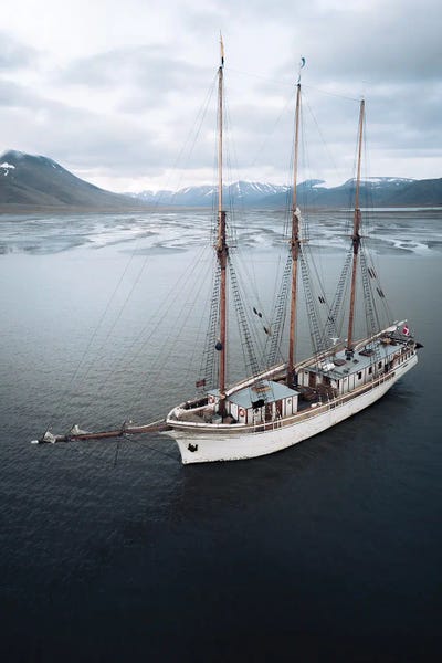 Sailing Ship Anchored In Svalbard In Front Of A Glacial River Delta