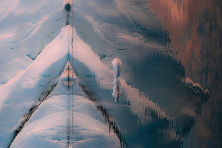 Reflection Of An Iceberg In Greenland During Sunset