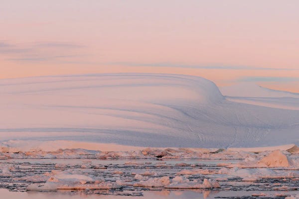 Smooth And Minimalist Iceberg In Greenland During Sunset