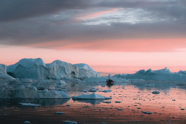 Ship Floating In Silence Through Icebergs In Greenland