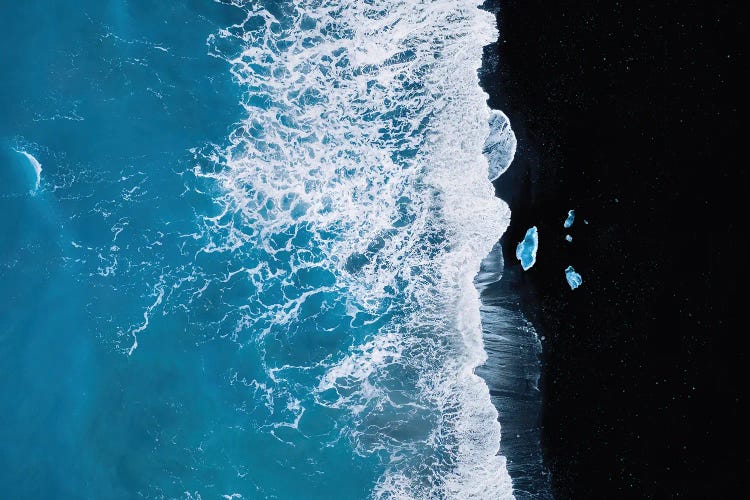 Abstract And Minimalist Black Sand Beach With Waves With Chunks Of Ice In Iceland