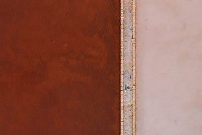 Abstract Minimal And Texture Rich Red And Pink Salt Farm From Above by Michael Schauer art print