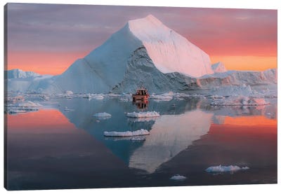 Lone Small Boat Floating In Front Of An Iceberg In Greenland During A Burning Sunset Canvas Art Print - Michael Schauer