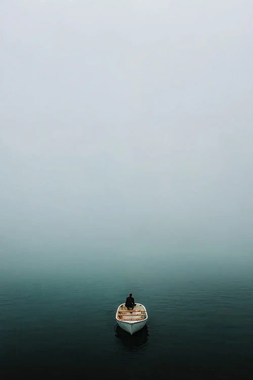 Lonely Person In A Boat At A Foggy Lake