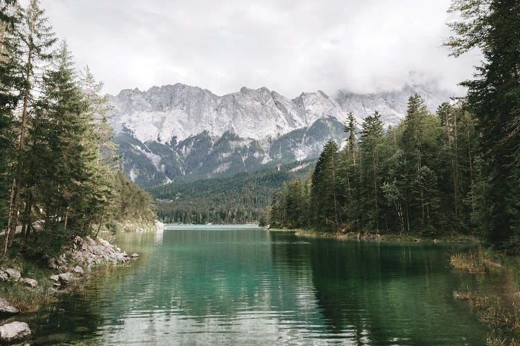 Calm Lake Eibsee With Zugspitze Mountain And Forest