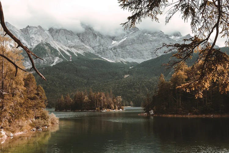 Calm Lake Eibsee With Zugspitze Mountain And Forest During Autumn