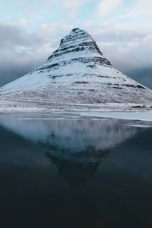 Kirkjufell Mountain In Iceland With Reflection On A Calm Morning