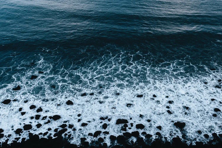 Water And Waves Coming On To A Black Beach In Iceland