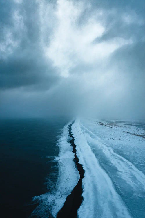 Infinite Black Sand Beach During A Snowy Day In Iceland