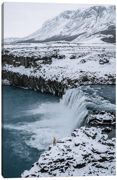Small Person Standing In Front Of An Icelandic Waterfall Canvas Art Print - Michael Schauer