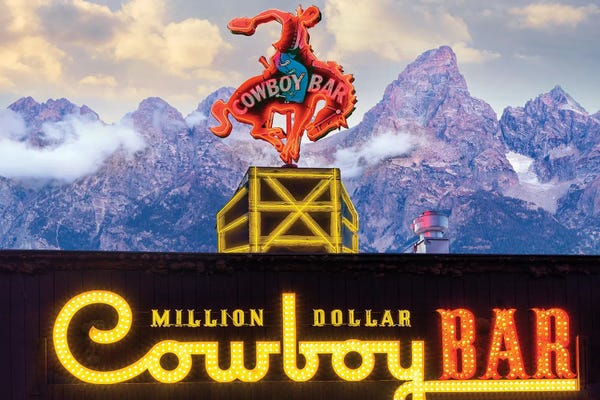Wyoming: Howdy Cowboy Bar And Grand Teton Mountains by Susanne Kremer