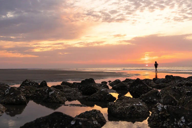 Silhouette Of A Woman Walking At Sunrise On Hunting Beach Sc by Susan Richey wall art