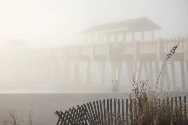 Coastal Sand Dunes: Morning Mist Creates Serene Atmosphere At Folly Beach Pier by Susan Richey