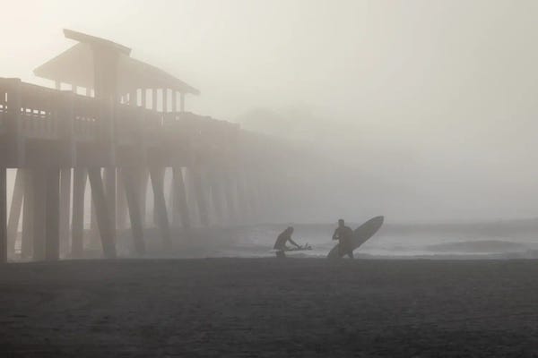 Surfers In Morning Fog Near Pier