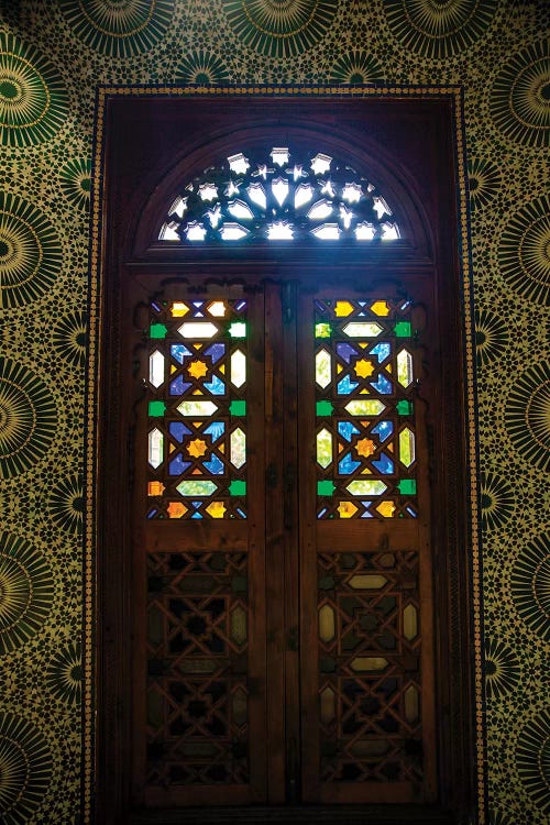 Marrakech, Morocco. Moroccan stained glass in wooden door