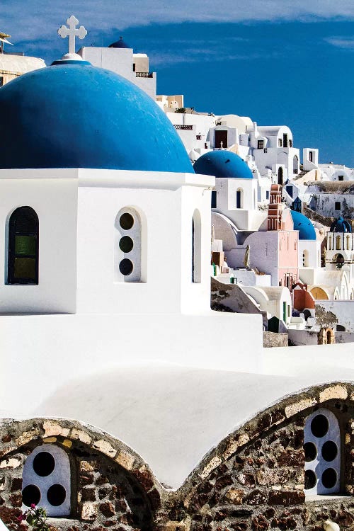 Oia, Greece. Row of Greek Orthodox Churches with blue domes.