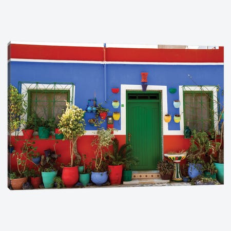 Asilah, Morocco. Multi-colored house with potted plants Canvas Print #SND7} by Jolly Sienda Canvas Print
