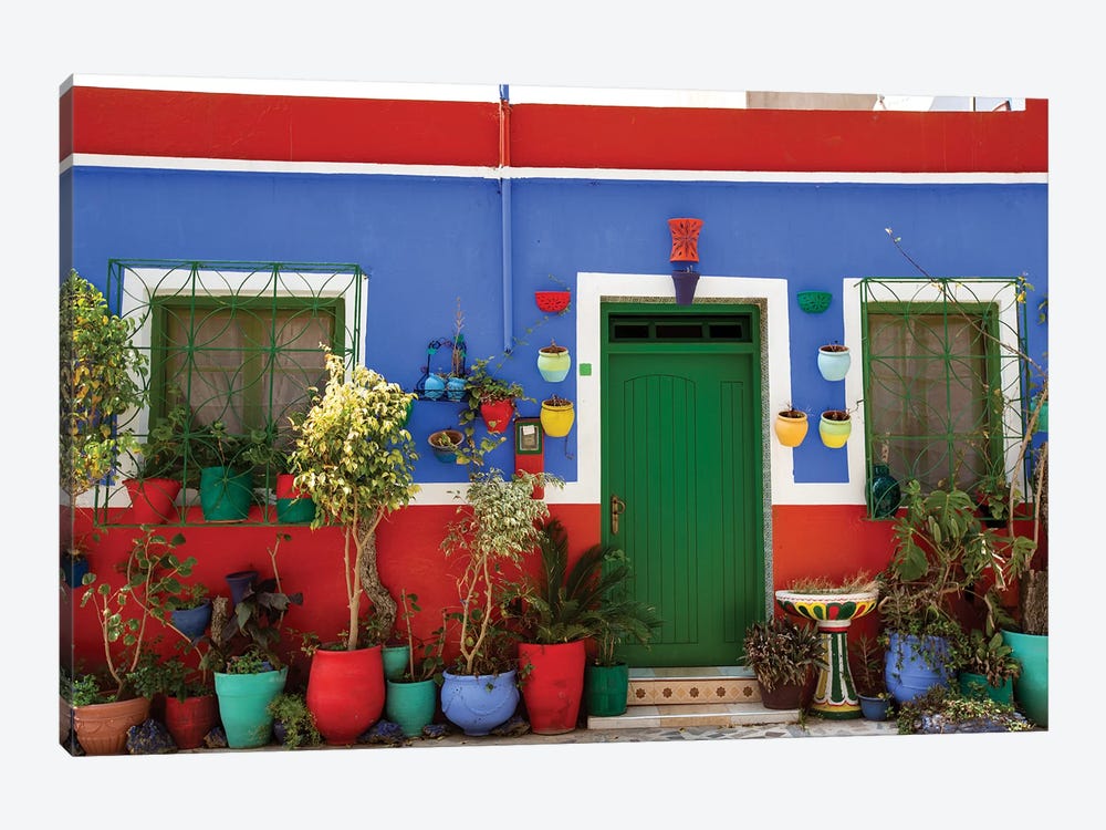 Asilah, Morocco. Multi-colored house with potted plants by Jolly Sienda 1-piece Canvas Print