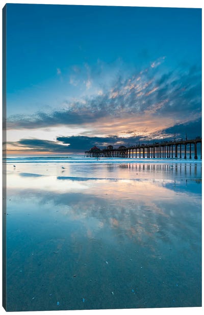 The Huntington Beach Pier And Reflections On The Wet Beach At Sunset. Huntington Beach, California. Canvas Art Print