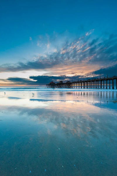 The Huntington Beach Pier And Reflections On The Wet Beach At Sunset. Huntington Beach, California.