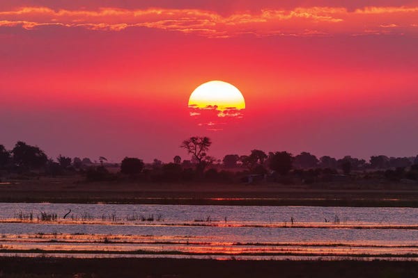 A Colorful Sunset Along The Banks Of The Chobe River, Chobe National Park, Kasane, Botswana.