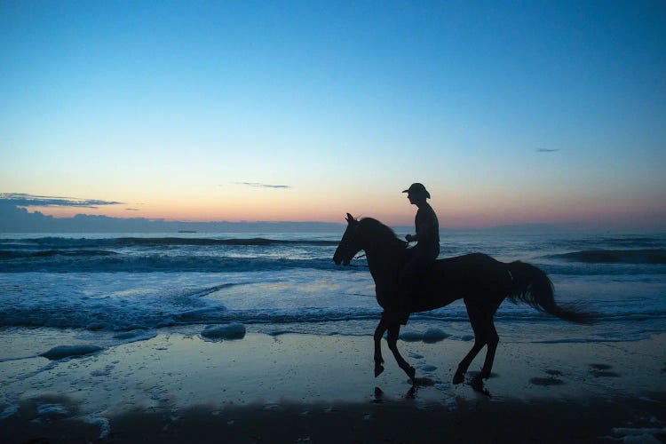 A Cowboy On Virginia Beach At Sunrise