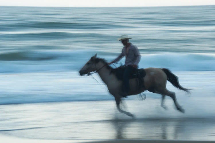 A Cowboy Rides A Horse On Virginia Beach, Virginia