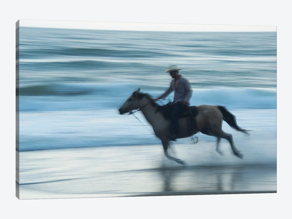 A Cowboy Rides A Horse On Virginia Beach, Virginia by Joel Sartore 1-piece Canvas Art Print
