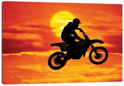 A Jumping Motocross Racer In Front Of The Sun Canvas Art Print - Extreme Sports