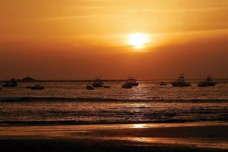 Boats On The Ocean At Sunset