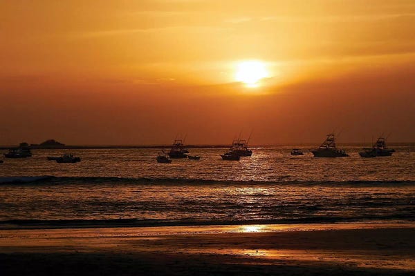 Boats On The Ocean At Sunset