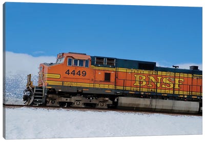 Orange Train In Snow Canvas Art Print - Susan Vizvary