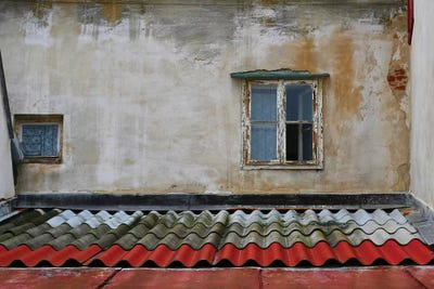 Tile Roof With Window by Susan Vizvary framed canvas print