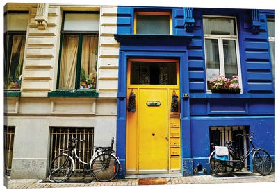 Yellow Door With Bikes Canvas Art Print - Susan Vizvary