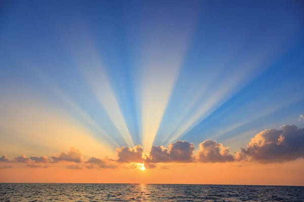 Lanai: Cloud formations after sunrise, Hulopo'e Bay, Lanai Island, Hawaii, USA by Stuart Westmorland