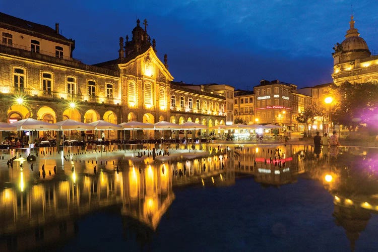 Portugal, Braga. Sunset along the sidewalk of cafe and town square at dusk, Praca da Republica