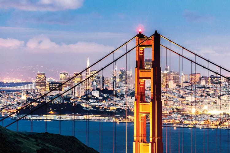 Tower Of Golden Gate Bridge At Dusk With Financial District In The Background, San Francisco, California, USA