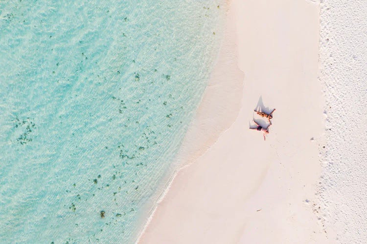 Aerial View Of Couple On A Sandy Beach, Maldives