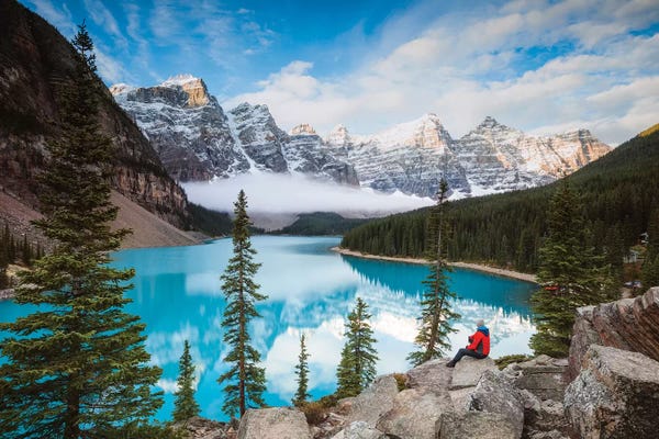 Snowy Mountains: Man Sitting Near Moraine Lake, Banff National Park, Canada by Matteo Colombo