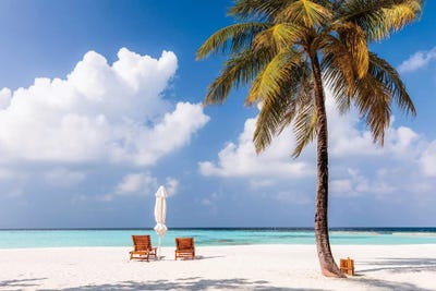 Sunchairs On A Beach In The Maldives by Matteo Colombo framed canvas print