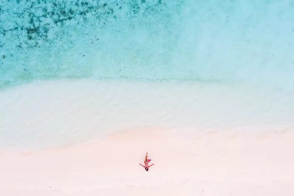 Aerial Beaches: Woman Relaxing On Beach, Maldives by Matteo Colombo