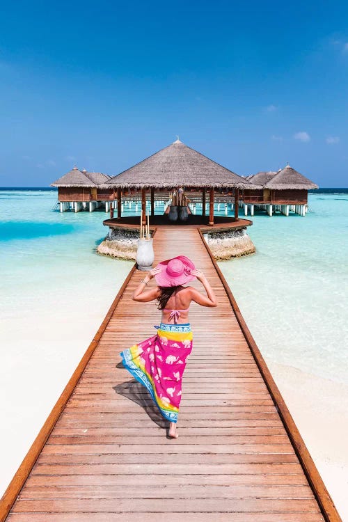 Woman With Sarong Walking On Jetty, Maldives by Matteo Colombo wall art