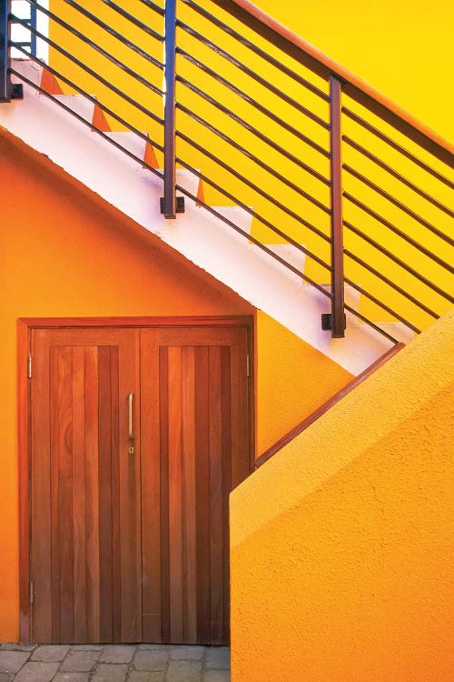 Geometric view of a yellow and orange stairway.