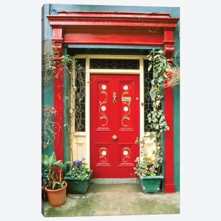 Red door with painted daisies, surrounded by flowers and vines. Canvas Print #TOH3} by Tom Haseltine Canvas Wall Art